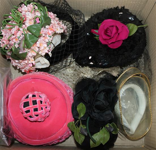 A collection of 1950s and later hats and two hat boxes